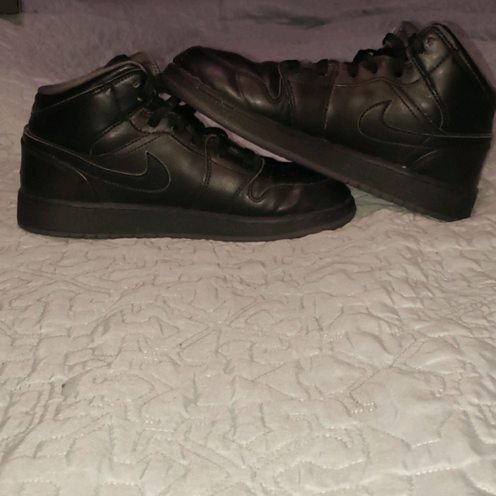 All black mid retro 1 Jordan's